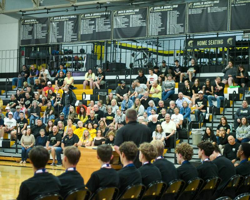 Sycamore boys track coach Michael Lambdin talks during the pep rally on Tuesday June 4, 2025, at Sycamore High School after the team brought back the championship trophy.