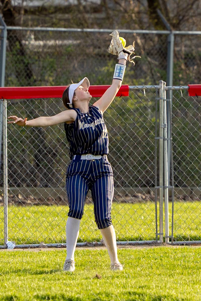 Kaeley Rick (12) of Marquette catches fly ball in left field on Wednesday, April 16, 2025 at Streator High School in Streator.