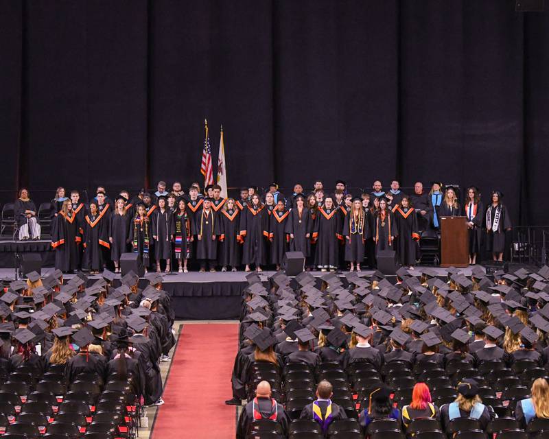 DeKalb High School choir sings during DeKalb High School’s  graduation ceremony on Saturday May 23, 2026, held at the Convocation Center in DeKalb.