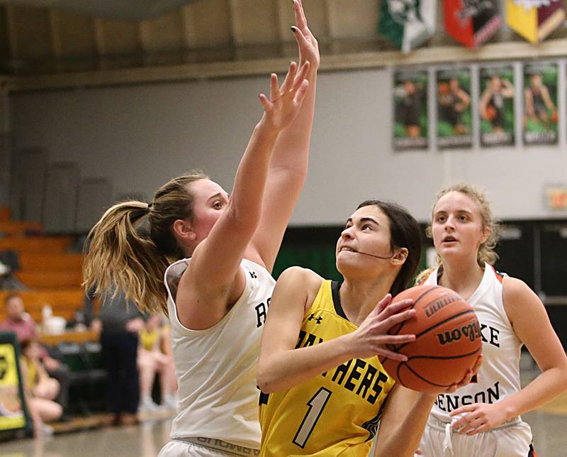 Putnam County's Ava Hatton runs in the lane to get around Roanoke-Benson's Clare Monge during the Tri-County Conference Tournament on Tuesday, Jan. 17, 2023 at Midland High School.