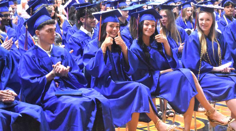 Genoa-Kingston’s Samantha Braffett, Zoe Boylen, and Kaya Bonovolonta give the thumbs up after earning their diplomas Sunday, May 17, 2026, during the commencment ceremony at Genoa-Kingston High School.