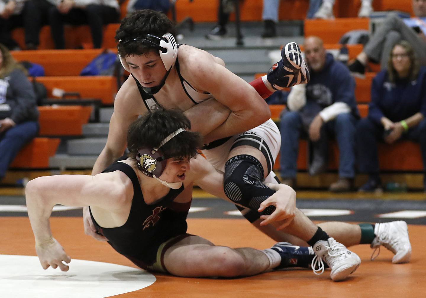 Fenwick’s Aiden Burns tries to control St. Ignatius’ Nate Sanchez as they compete in the 157-pound championship match in the IHSA 2A Crystal Lake Central Wrestling Sectional on Saturday, Feb. 15, 2025, at Crystal Lake Central High School.