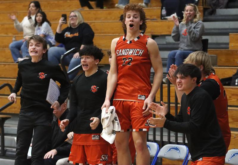 Sandwich players get revved up as the Indians rally during the fourth quarter in varsity boys basketball on Tuesday, Feb. 11, 2025, at  Woodstock High School in Woodstock.