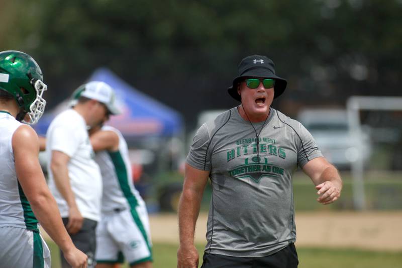 Glenbard West Head Coach Chad Hetlet yells to his team during a 7 on 7 tournament on Thursday, June 26, 2025 at Naperville North.