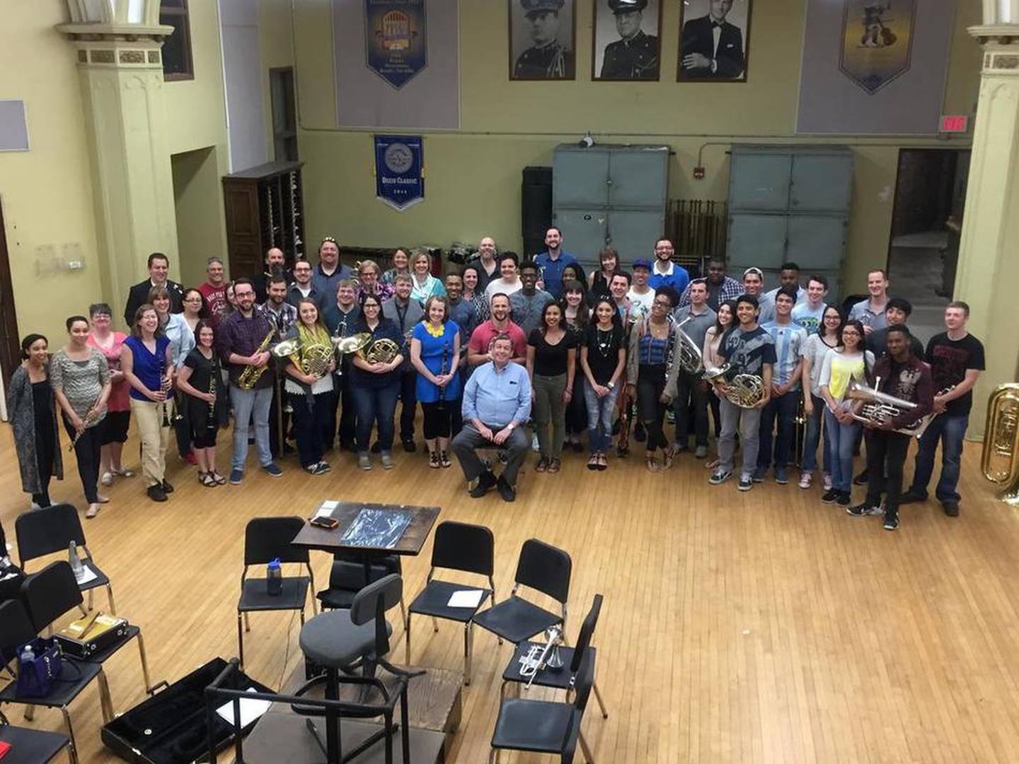 Joliet Central High School Band Director Mike Fiske enjoys a surprise arrival and rehearsal from his former students Saturday before Sunday's farewell concert. Fiske retires after 39 years in music education, most of his years teaching at Morris Community High School and Central.