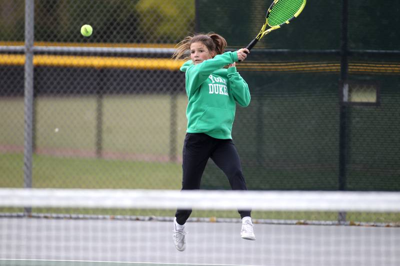 York’s Lizzie Isyanov returns the ball during the first day of the IHSA state tennis tournament at Fremd High School on Thursday, Oct. 20, 2022.