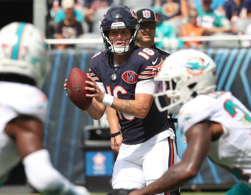 Chicago Bears quarterback Austin Reed looks for an open receiver in the Miami Dolphins secondary Sunday, Aug. 10, 2025, during their game at Soldier Field in Chicago.