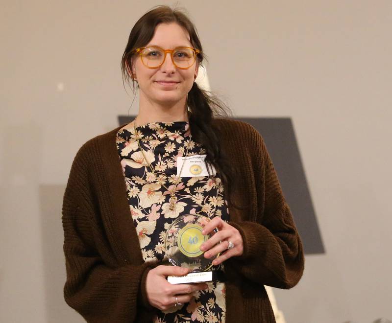 Amanda Weygand, Owner, Open Space Art Gallery and Studios poses with her award during the Illinois Valley Chamber of Commerce 40 Under Forty Awards Gala on Thursday, Feb. 9, 2023 at Westclox in Peru.