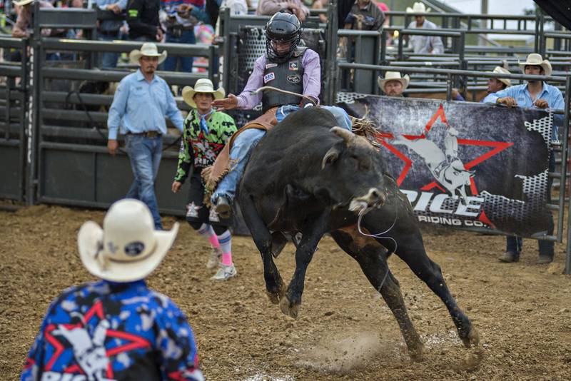 Kevin Klemm of Manawa, Wisconsin stays atop Spot On during the Rice Bull Riding rodeo.