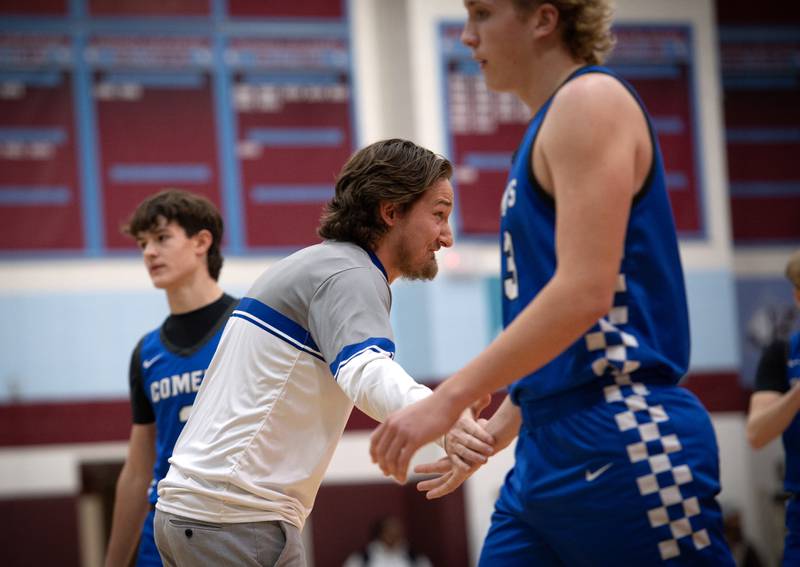 Clifton Central's head coach Brandon Schoon talks with players during a time out in a game against Christ the King in the Kankakee Holiday Tournament at Kankakee High School on Saturday, December 27, 2025.