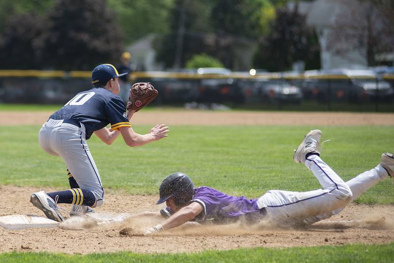 Dixon’s Gage Burdick dives back to third but is called out Sterling Saturday, May 28, 2022.