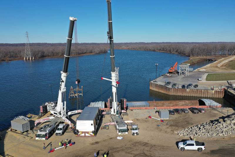 A crew from Atlas Crane Services hoist a 300,000 pound boiler made by the Cleaver-Brooks company in Lincoln Neb. on Wednesday Dec. 13, 2023 at Marquis Energy in Hennepin.. The boiler was transported by barge to to Hennepin from Nebraska using the Missouri River, Mississippi River and Illinois River. Marquis Energy is expected to receive several boilers within the next 12 months.