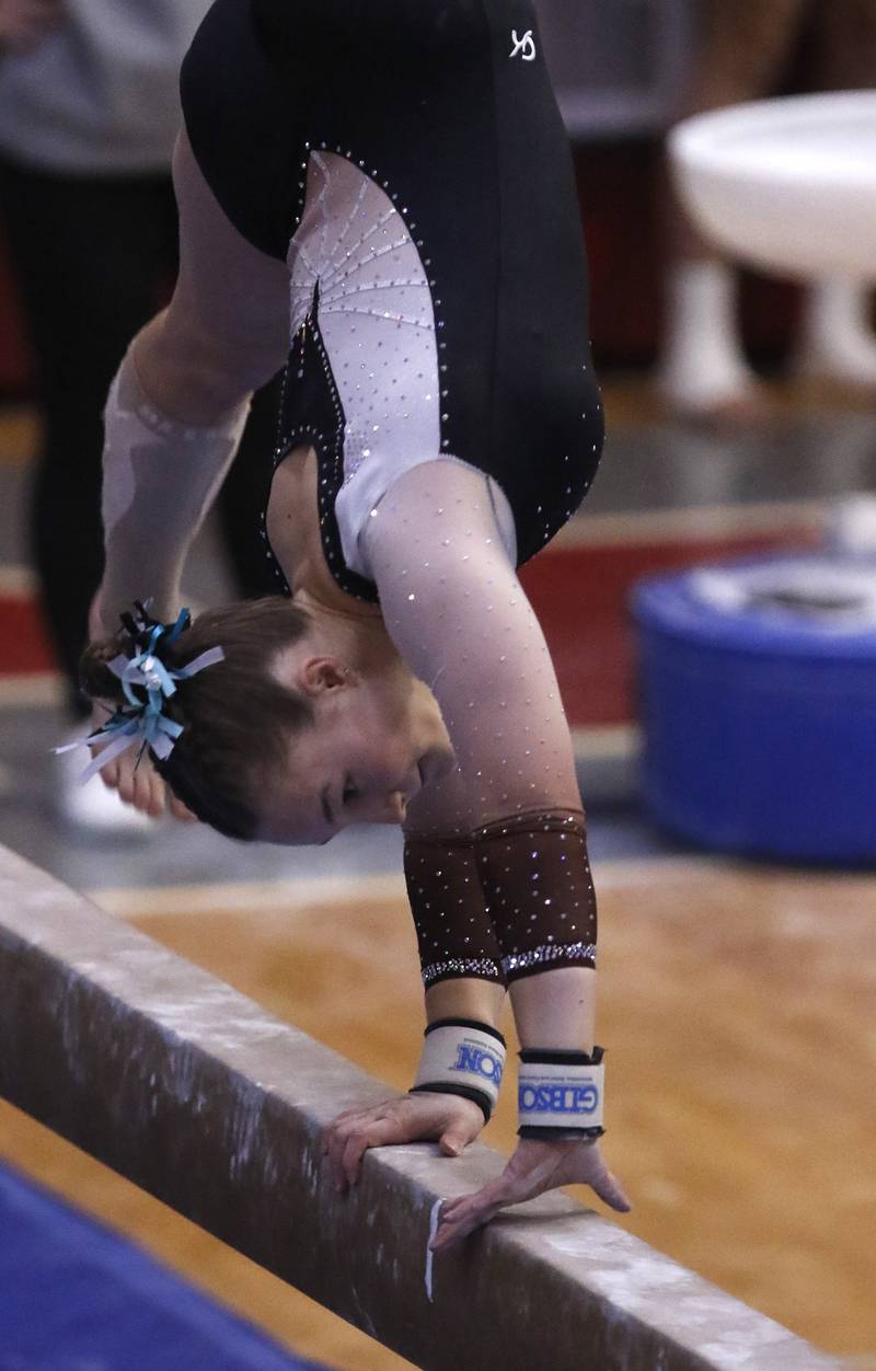 Lincolnway East's Rylee Miller competes in the preliminary round of the balance beam on Friday, Feb. 21, 2025, during the IHSA Girls State Final Gymnastics Meet at Palatine High School.