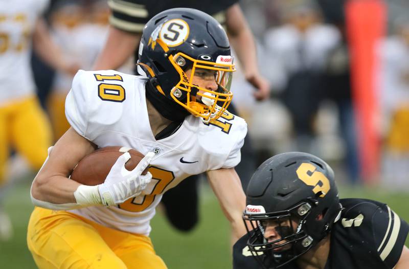 Sterling's Cale Ledergerber tries to run through Sycamore's Dawson Alexander during their Class 5A state playoff game Saturday, Nov. 12, 2022, at Sycamore High School.