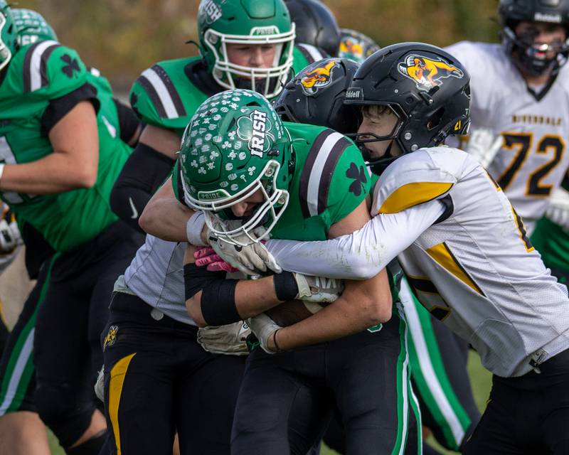 Cam Shriey (33) of Seneca is held by Riverdale's defense whilst running ball on Saturday, November 1, 2025 at Seneca High School in Seneca.