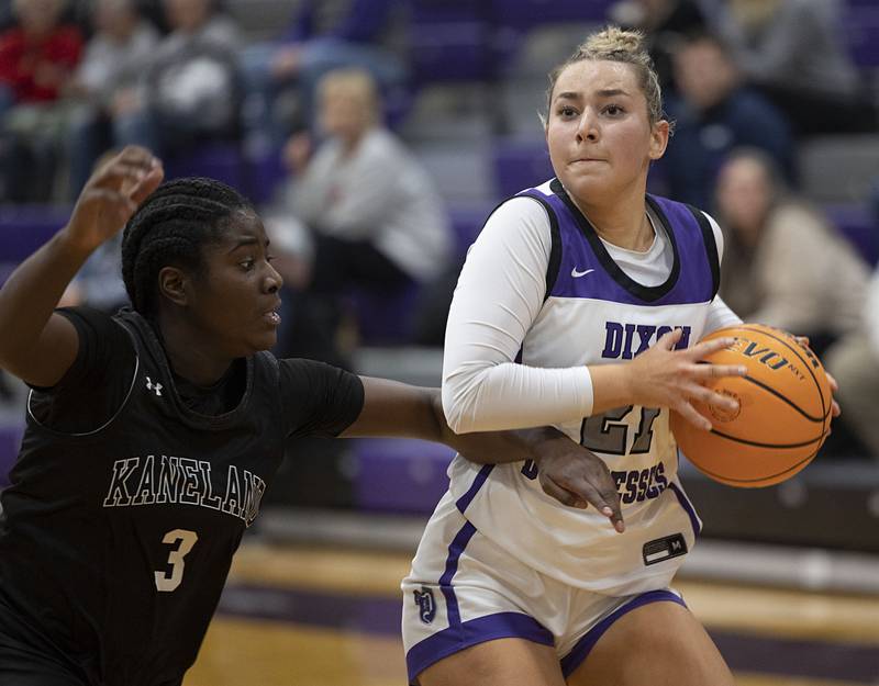 Dixon’s Presley Lappin looks to put up a shot against Kaneland’s Daniela Ridolfi (left) and Lillyana Crawford Wednesday, Dec. 10, 2025.