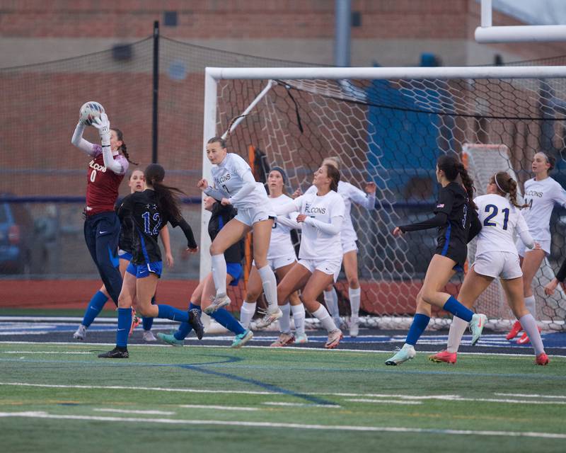 Wheaton North's Leah Roe makes the jumping catch against St. Charles North on Thursday, April 10,2025 in St. Charles.