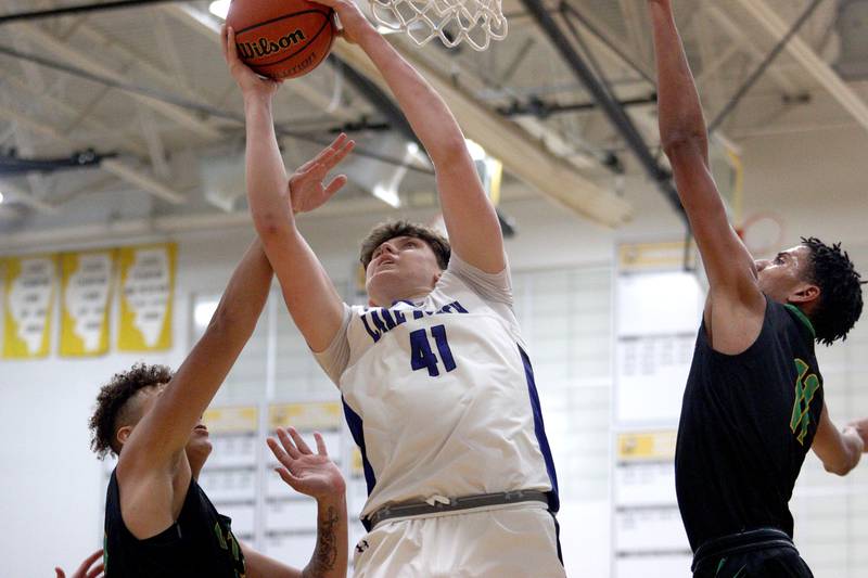 Lake Zurich’s Anton Strelnikov works under the hoop in Hinkle Holiday Classic boys basketball tournament game action at Jacobs High School Wednesday.