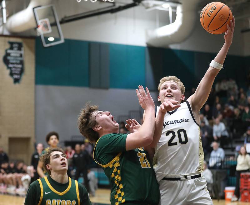 Sycamore's Isaiah Feuerbach shoots the ball over Crystal Lake South's Ryan Morgan during an IHSA Class 3A Woodstock North Sectional semifinal.basketball game on Wednesday, March 4, 2025, at Woodstock North High School.