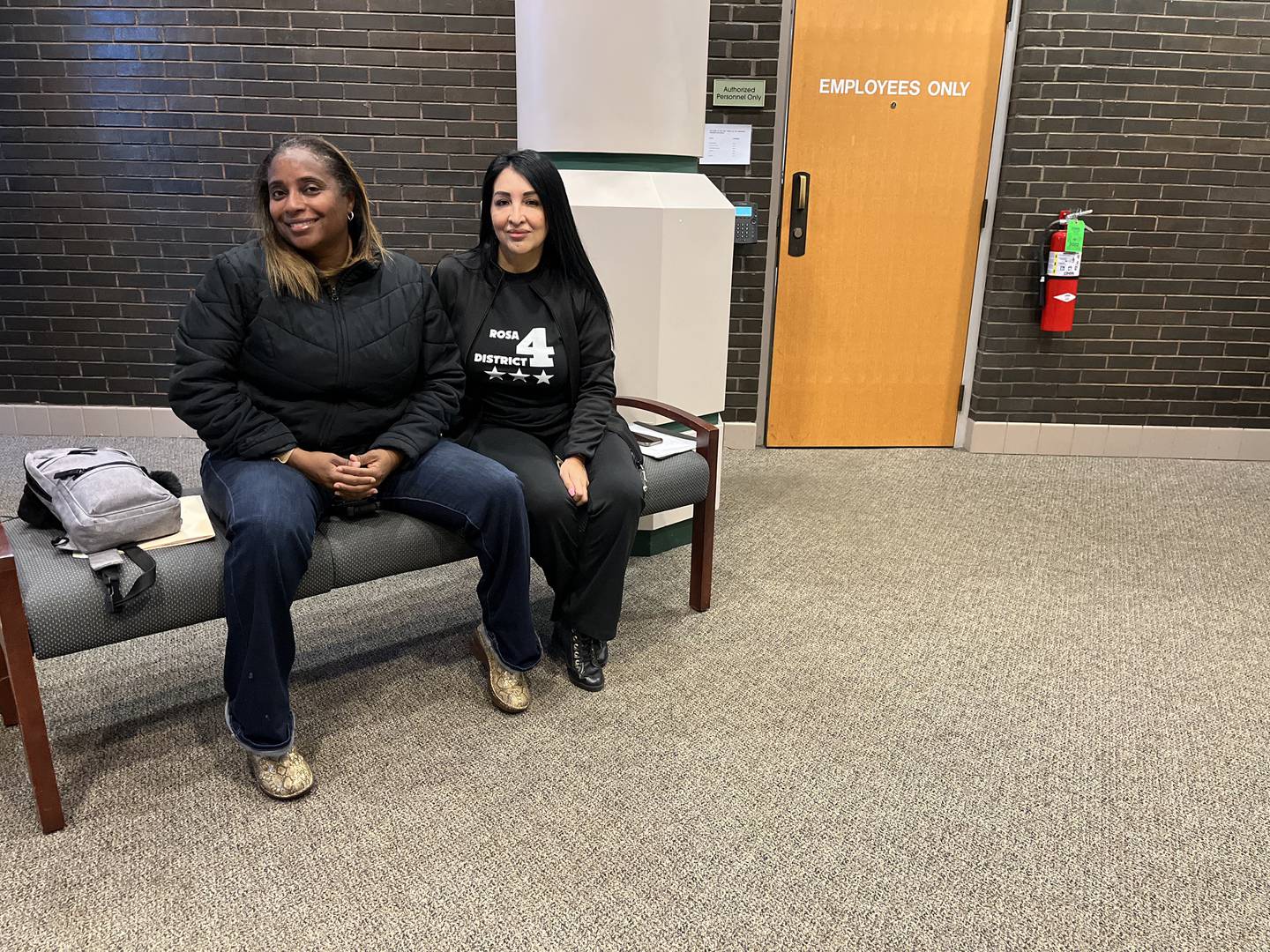 Janean Jackson (left), Joliet City Council District 3 candidate, and Rosa Hernandez, Joliet City Council District 4 candidate, sit inside Joliet City Hall on Monday, Dec. 12, 2022, waiting to file candidacy petition with the clerk's office.