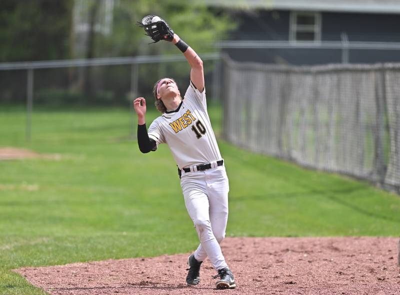 Joliet West's Parker Schwarting catches a pop fly during the non-conference game against Lockport on Saturday, April. 27, 2024, at Lockport.