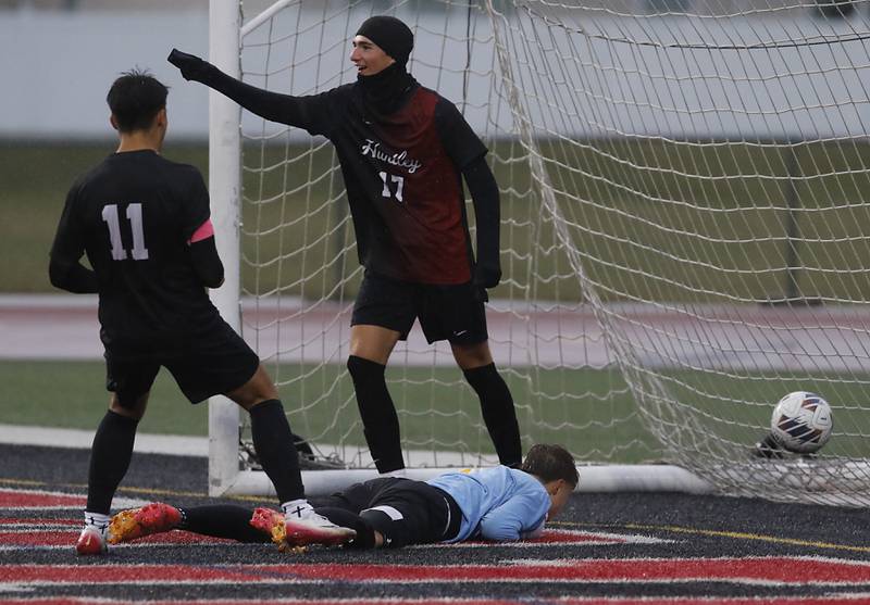 Huntley's Cody Hammer (center) celebrates a Huntley goal with teammates, Allen Williams, (left) during an IHSA Class 3A Huntley Regional boys soccer semifinal match against Jacobs on Tuesday, Oct. 21, 2025, at Huntley High School.