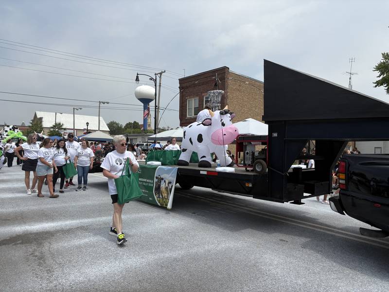 An inflatable cow rides on a float during the Harvard Milk Days parade June 7, 2025.