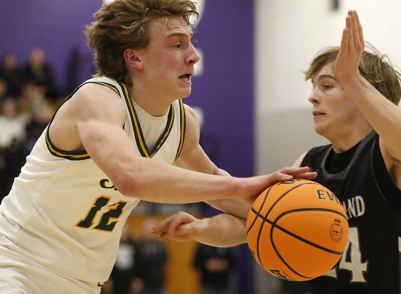 Crystal Lake South's Drake Lenckus drives to the basket against Kaneland's Luke Reinert during the IHSA Class 3A Rochelle Sectional championship basketball game on Friday, March 7, 2025, at Rochelle High School.
