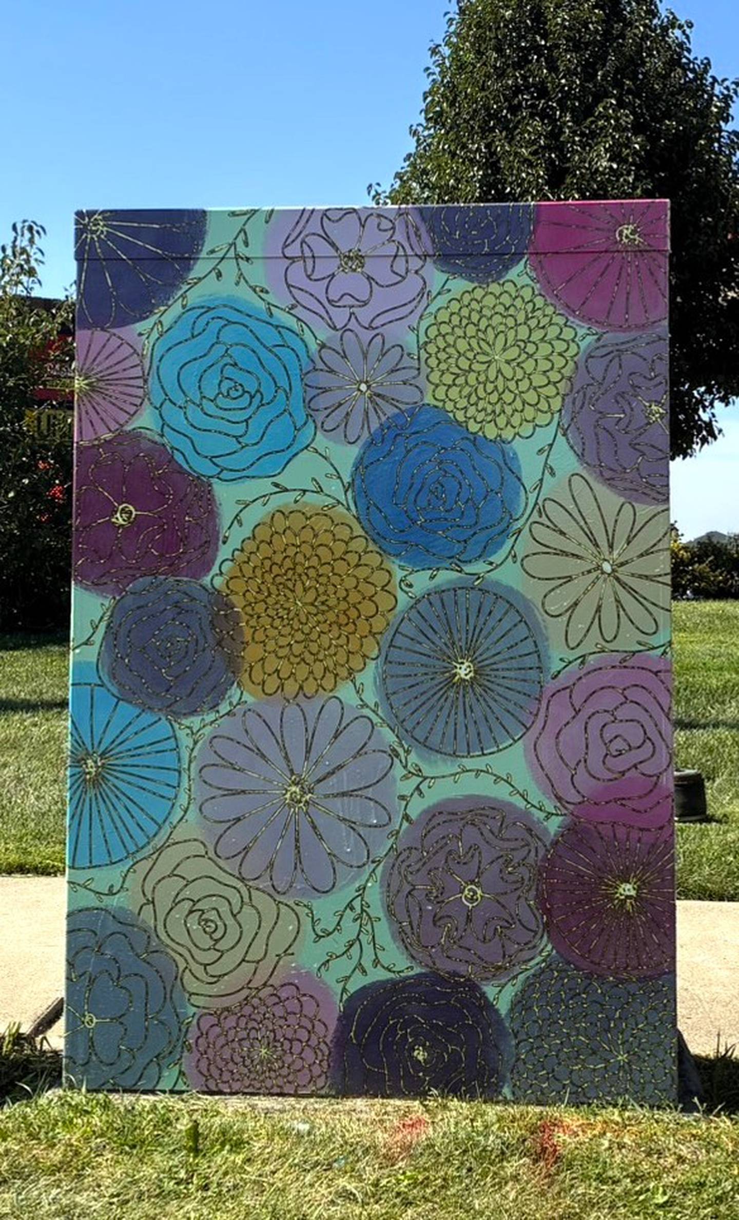 The painting “Golden Doodle” by Lise Schlosser of DeKalb is featured on the utility box mural at Annie Glidden Road and Hillcrest Drive in DeKalb.