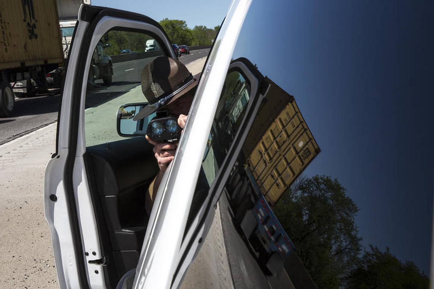 Trooper Dan Kenshol runs radar on Thursday, May 23, 2019, on I55 in Joliet, Ill. Scott's Law is named after Lieutenant Scott Gillen of the Chicago Fire Department who was struck and killed by an intoxicated driver while assisting at a crash. It requires drivers approaching police or emergency vehicles who are stopped on the roadway to reduce speeds, proceed with caution and switch lanes, if possible.