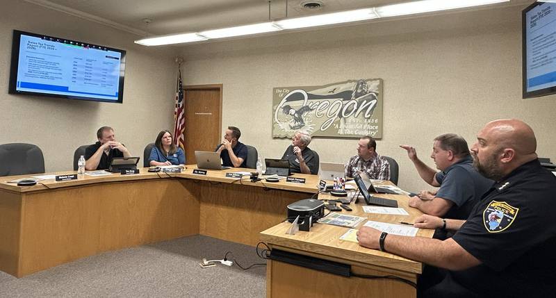 Oregon City Administrator Darin DeHaan (second from right) speaks at the City Council meeting on Tuesday, Sept. 23, 2024.