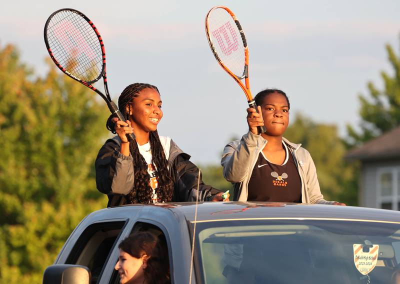 DeKalb High School tennis players head down Dresser Road Wednesday, Sept. 27, 2023, during the homecoming parade.
