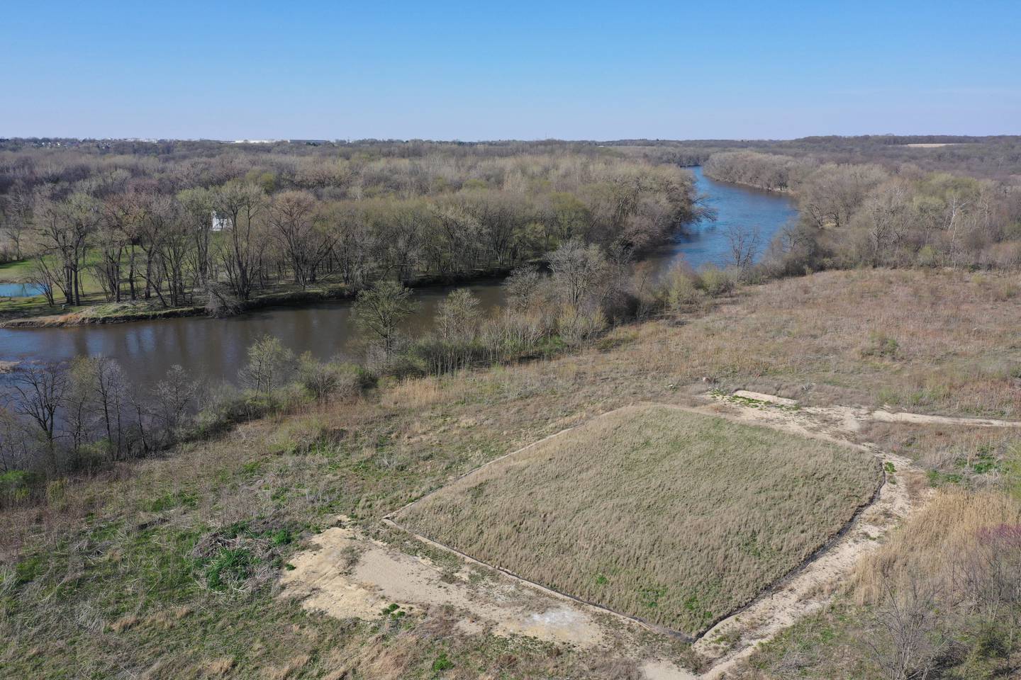 An aerial view of the last of the Ottawa radium disposal Environmental Protection Agency Superfund site just south of the Illinois Route 71 and U.S. Route 6 intersection on Thursday, April 13, 2023 in Ottawa. The EPA will start cleanup soon thanks to $90 million from the infrastructure bill. The 17-acre parcel contains the last remaining contamination from the radium dial painting that took place in the early part of the 20th century. Cleanup will allow the city of Ottawa to reclaim the land and transform it into a community asset for generations to come. The project will see about 200,000 tons of contaminated material removed from the site. Contamination originated from the Radium Dial company that operated in Ottawa from 1918 to 1930, a company that painted the face of clocks manufactured at Westclox in Peru.