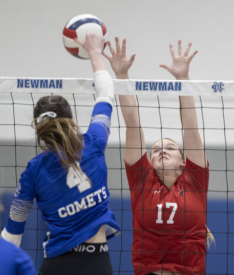 Newman’s Ruby Burger spikes against Hall’s Caroline Morris Tuesday, Oct. 21, 2025.