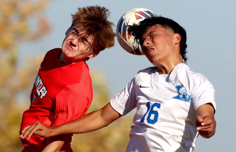 Huntley’s Gavin Eagan, left, battles Larkin’s Atlai Gutierrez in boys soccer regional action at South Elgin on Saturday.