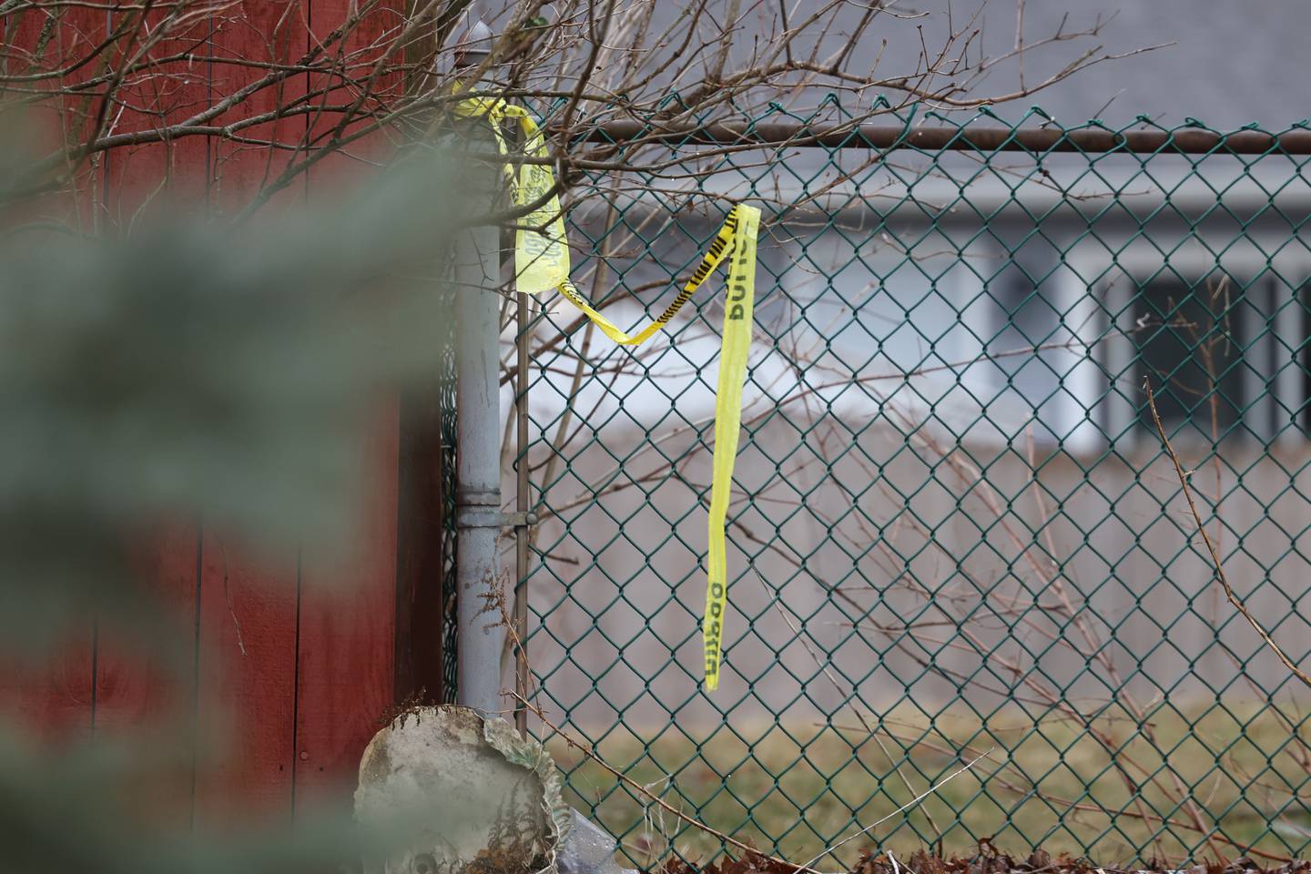 Police tape hangs on the fence at the scene of three fatalities in a possible home invasion along the 100 block of Lee Lane on Sunday, March 5th, 2023 in Bolingbrook.