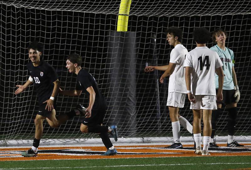 McHenry's Aldair Anglada (left) celebrates his goal during a Fox Valley Conference boys soccer match against Prairie Ridge on Tuesday, Sept. 30, 2025, at McCracken Field in McHenry.