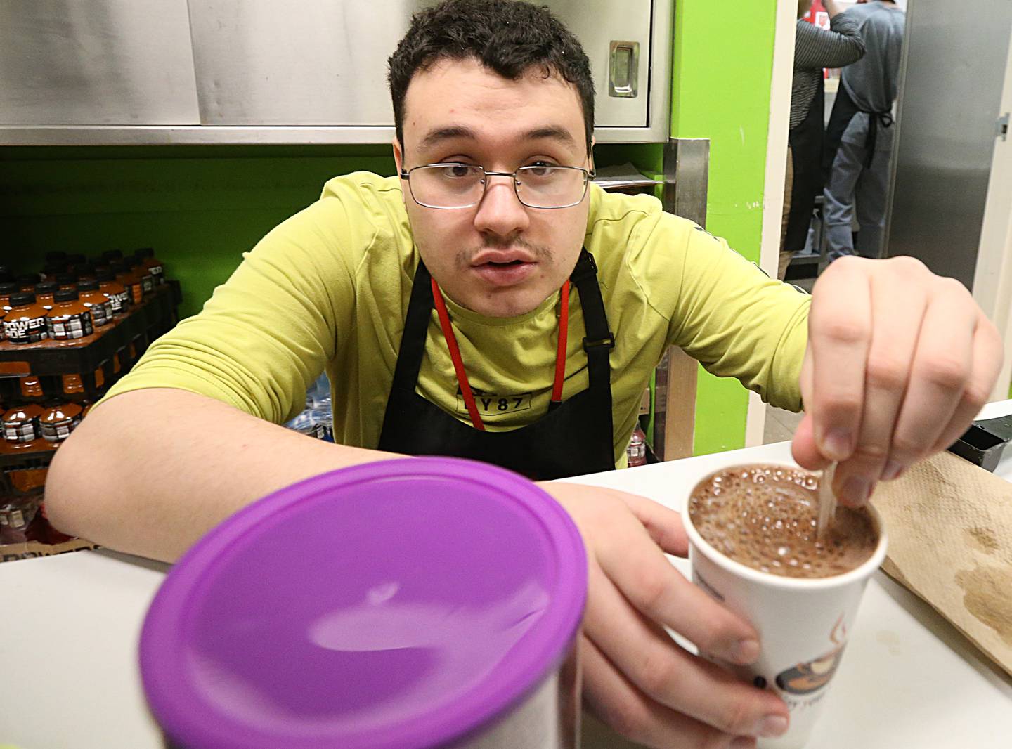 Eric Poole, student at La Salle-Peru Township High School, mixes up a cup of hot chocolate in the Cavs Sip-n-Savor cafe on Tuesday, Jan. 31, 2023 at L-P High School.