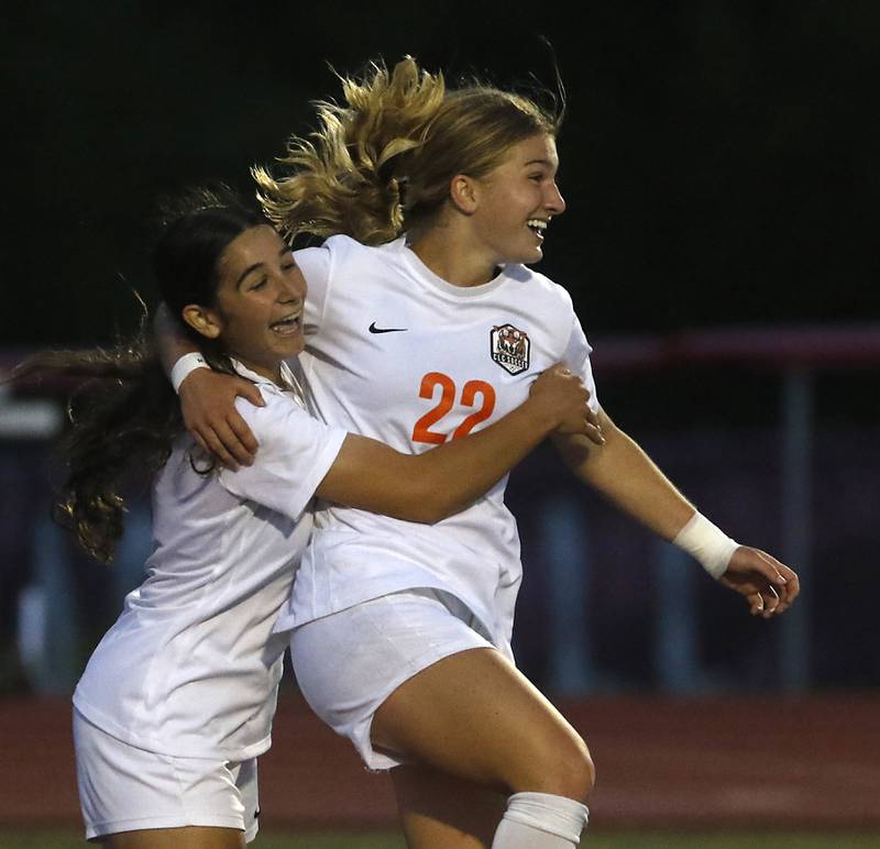 Crystal Lake Central's Olivia Anderson is hugged by her teammate, Addison Schaffer, after Anderson scored a goal during the Class 2A Deerfield Supersectional girls soccer match against St. Ignatius College Prep on Tuesday, May 28, 2024, at Deerfield High School.