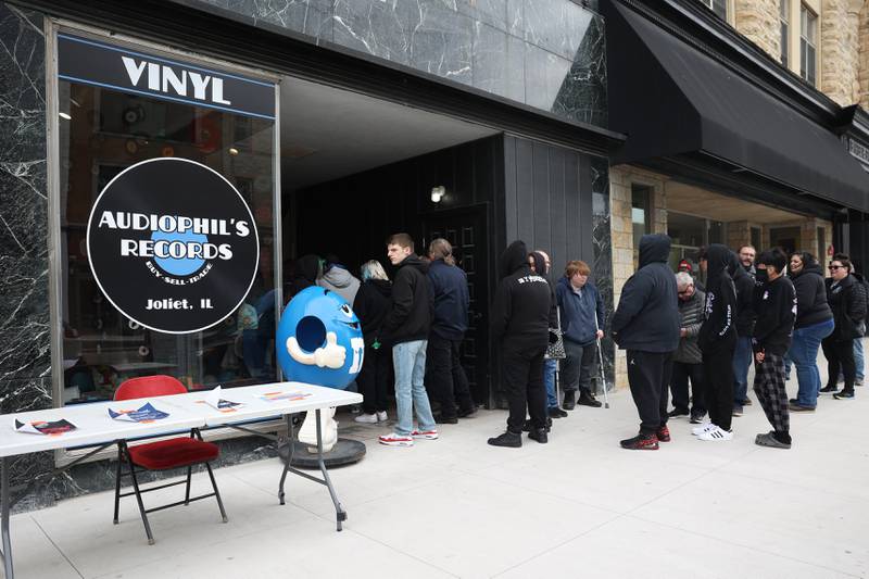 People line up to get into Audiophil’s Records’ new location opening day on National Record Store Day on Saturday, April 20, 2024 in Joliet.