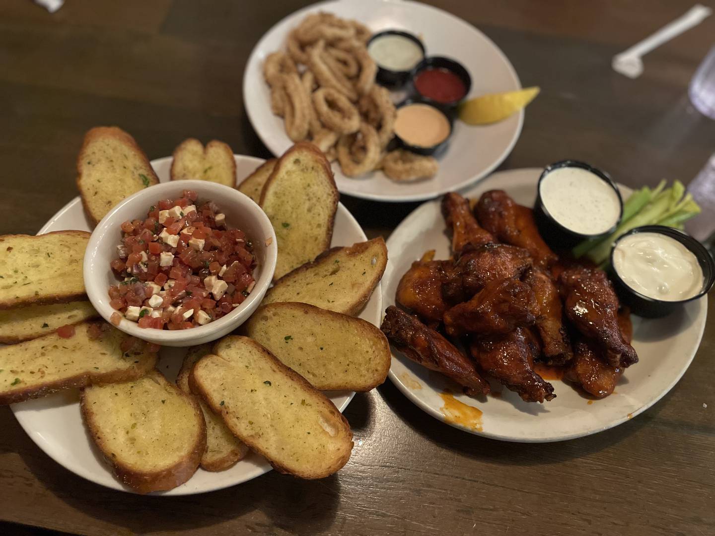 Bruschetta ($9.75), Calamari ($14.25), Buffalo Wings ($15.75) at Georgio's Chicago Pizzeria & Pub, 75 E Woodstock St. in Crystal Lake.