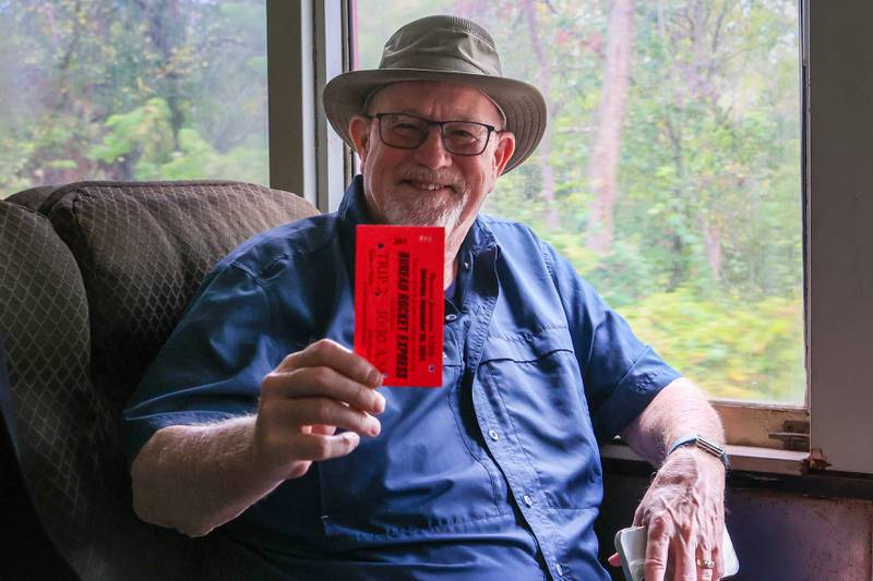 Terry Libby holds train ticket and poses for picture during train ride on Saturday, September 28, 2024 in Bureau.