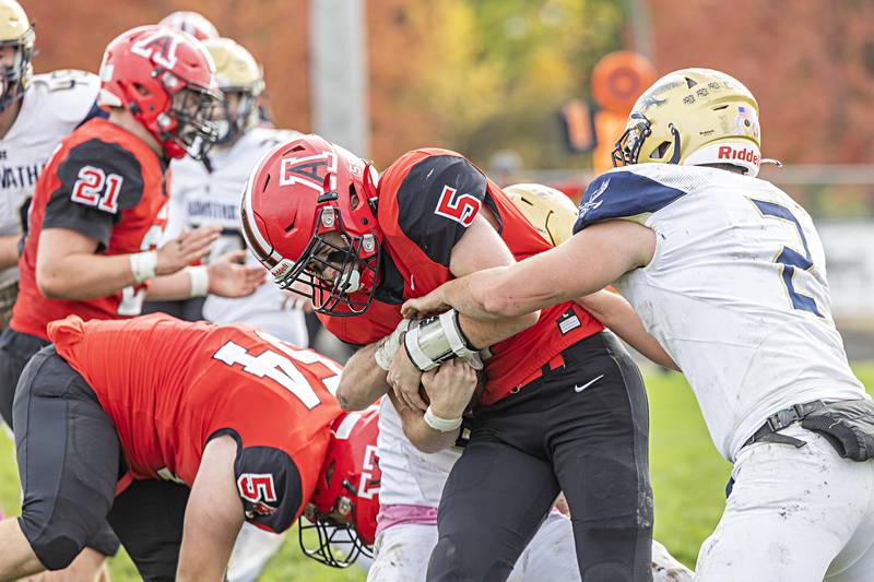 Amboy’s Landon Whelchel fights for yards Saturday, Oct. 28, 2023 against Hiawatha in the I8FA playoffs in Amboy.