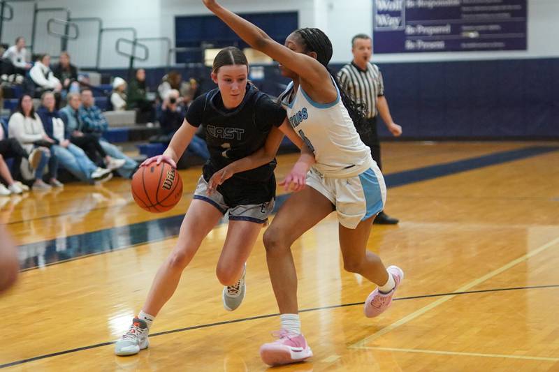 Oswego East's Aubrey Lamberti (1) drives to the basket against Downers Grove South's Hayven Harden (4) during a 4A Oswego East Regional semifinal girls basketball game at Oswego East High School on Monday, Feb 12, 2024.