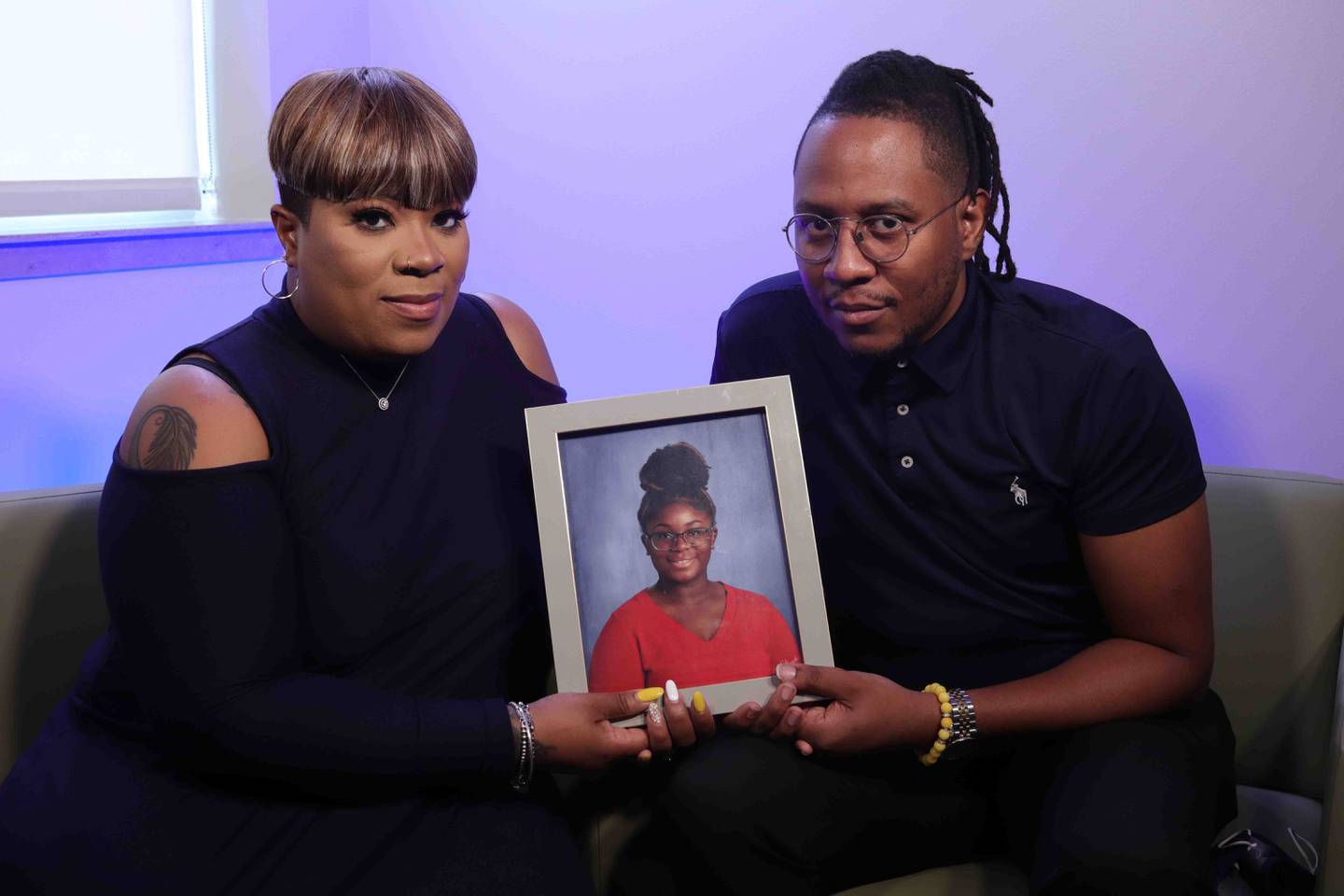Krystal Morgan and Rashad Bingham of Bolingbrook hold a photo of their 15-year-old daughter Dykota Morgan, who died of complications from COVID-19 two days after she tested positive. The Will County Health Department is holding a COVID-19 vaccination clinic in Dykota's honor on June 26.