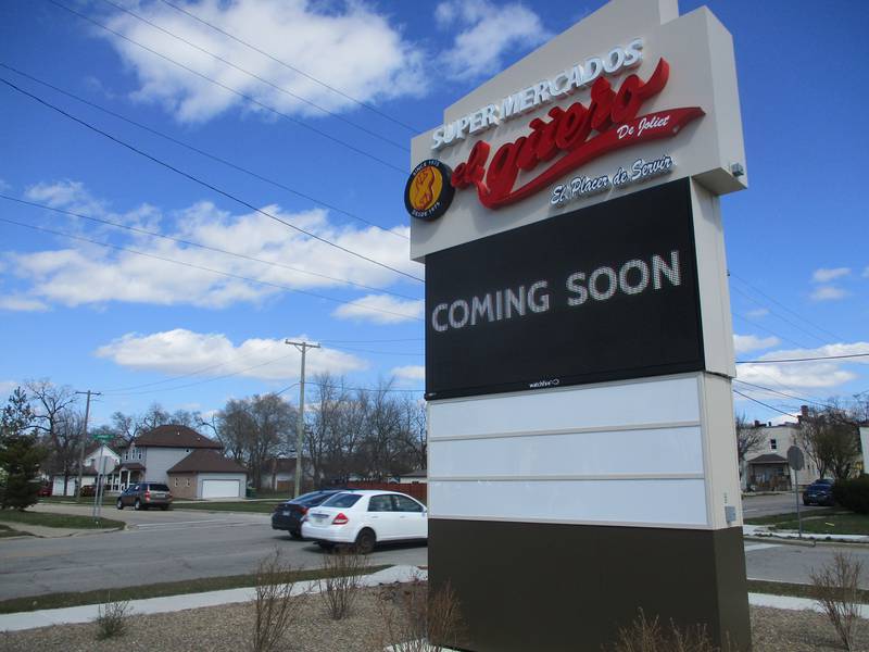 An electronic sign on the edge of the El Guero parking lot tells Jackson Street motorists that the Joliet supermarket will open soon. March 23, 2024.