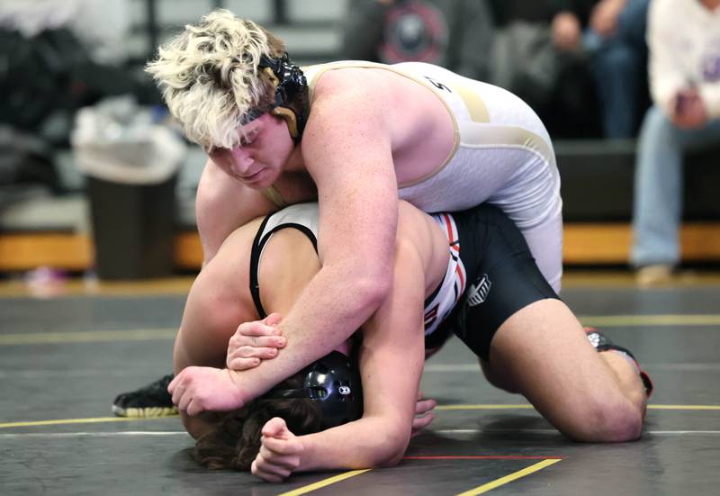 Sycamore’s Gable Carrick controls Kaneland’s Max Pietak in their 195 pound championship match Saturday Jan. 21, 2023, during the Interstate 8 Conference wrestling tournament at Sycamore High School.