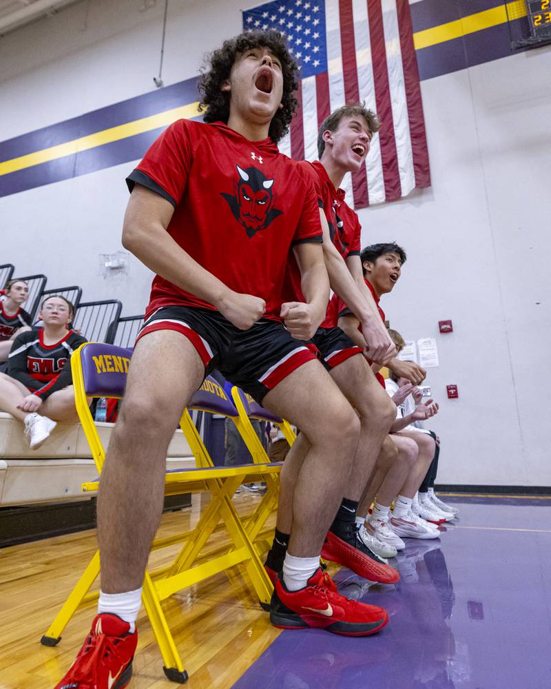 Anthony Reeser and Clayton Fusinetti celebrate a three point shot by Hall High School during the game on January 24, 2025 at Mendota High School.