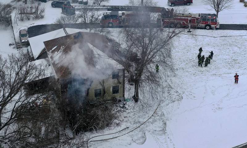 Firefighters work the scene of a structure fire on Friday, Jan. 10, 2025 at a residence located in the 2500 bock of East 1569th Road (Covel Bluff Lane) in Ottawa. The fire was upgraded to the second alarm. Firefighters from Oglesby, Utica, Grand Ridge, Marseilles, Tonica and others assisted with the fire.