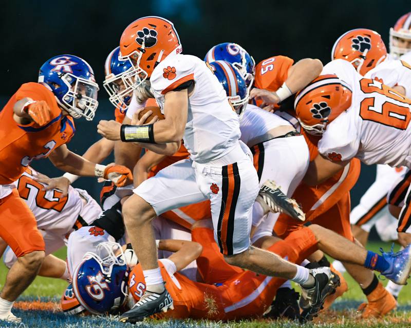 Byron QB Branden Smith runs the ball in the first quarter Friday Sep 16th while traveling to Genoa-Kingston.